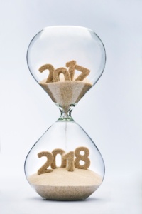 New Year 2018 concept with hourglass falling sand taking the shape of a 2018